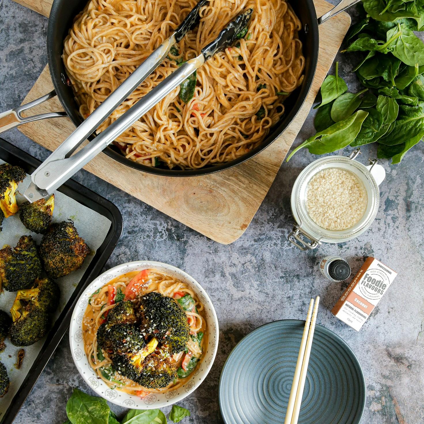 Community members collaborating in a contemporary kitchen, sharing recipes and cooking methods